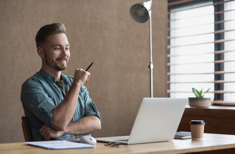 A man in an office learns the difference between business reports and business proposals.