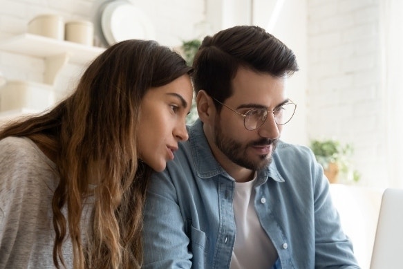 A photo of two people discussing an advance directive.