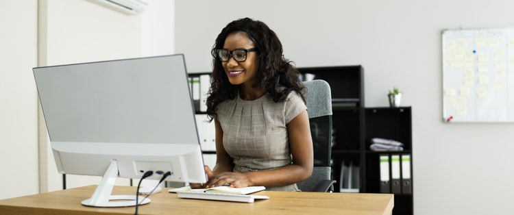 A woman in an office learns how to open a PDF in Word.