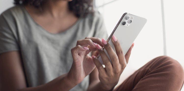 A woman searches a PDF file using an iPhone.
