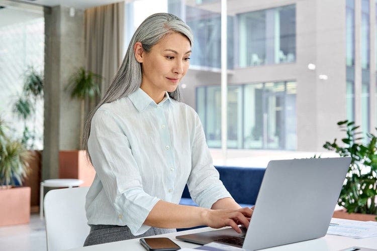 A woman converts a PDF to an RTF file.