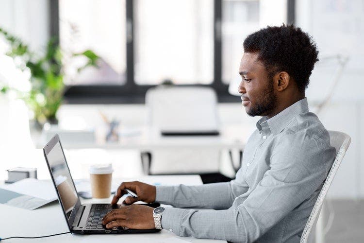 A man emails and shares a PDF using his Chromebook.