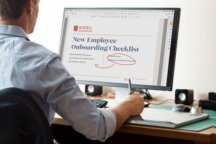 A person draws directly on a PDF while using a PC.