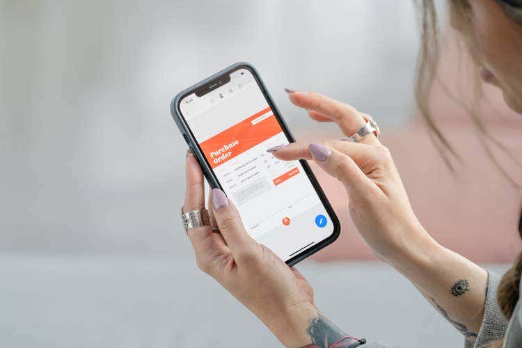 A user reduces the files size of a PDF on an iPhone.