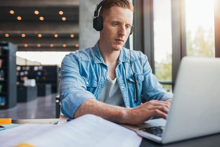 A man writes an appeal letter for college.