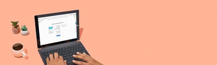 Laptop with Adobe Acrobat open showing “Export your PDF to any format” on the screen.