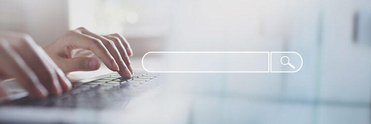 Person's hands on a laptop keyboard overlaid with a conceptual diagram of a search box.