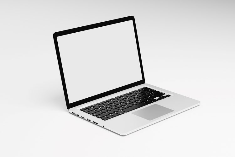 Laptop computer with blank white screen isolated on white background