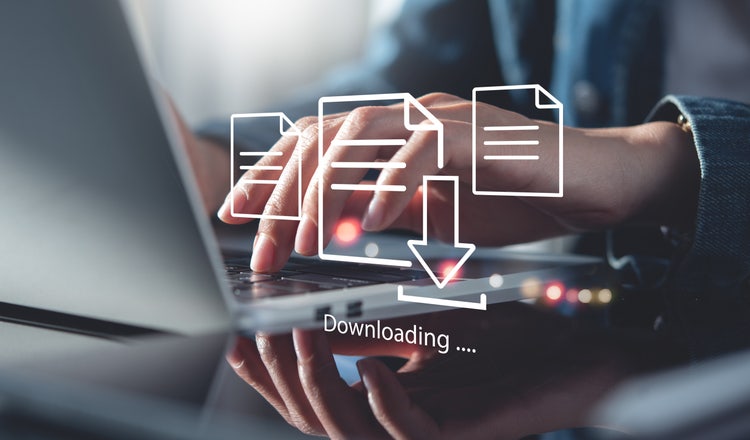 A businessman downloading files or installing software on a laptop, illustrating cloud storage, data backup, and cyber security technology.