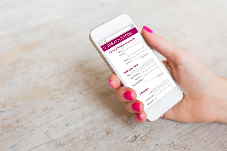 Mobile phone displaying a job application form, illustrating the ease of filling out forms digitally on a handheld device.