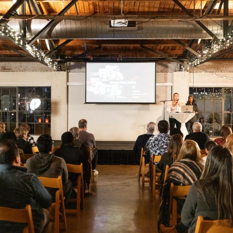 Attendees at a presentation in industrial-style space, Picture