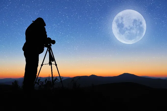 Photographer taking photos of the moon