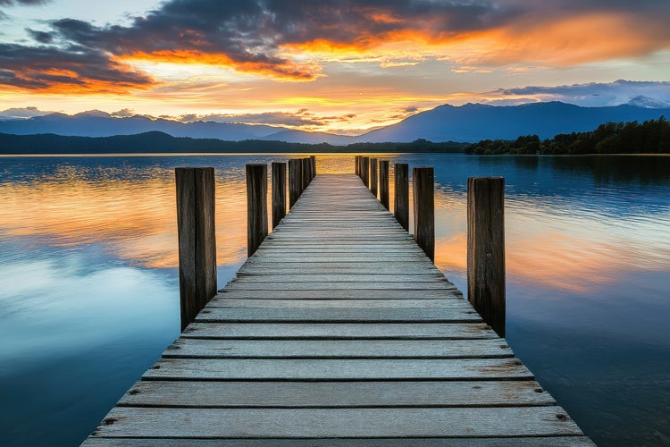 Pier during sunrise, and the bridge in the centre forming a triangle shape.