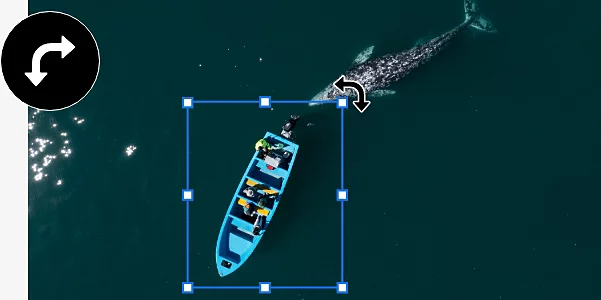 An image of a boat and a whale in the ocean. The boat has been separated into its own layer, which has a point identification box around it so that it can be rotated.