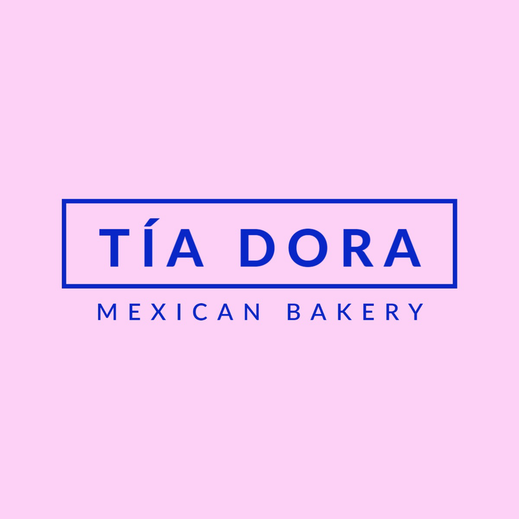 Tía Dora Mexican Bakery logo written in the fonts Lato Heavy and Semibold in dark blue against a light pink background