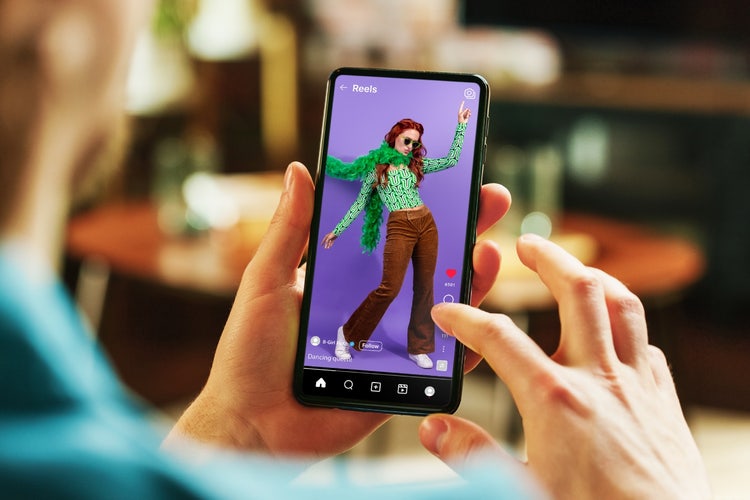 A person holding a phone AI-generated content may be incorrect.