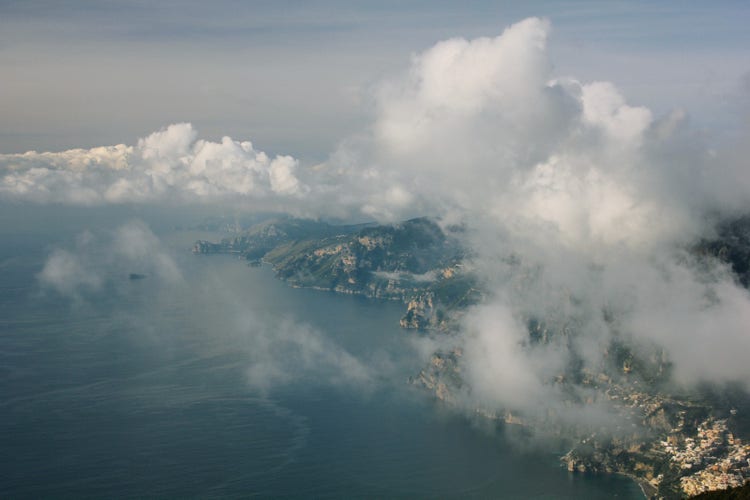 Aerial view of a sea and clouds Description automatically generated with medium confidence