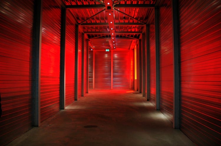 A long hallway with red lights Description automatically generated