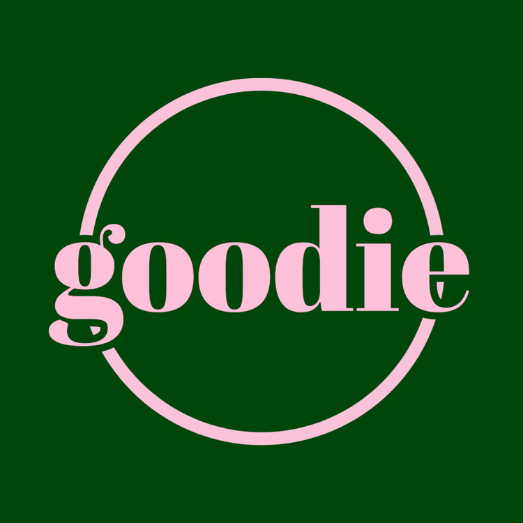 goodie logo written in the font Abril in light pink against a dark green background