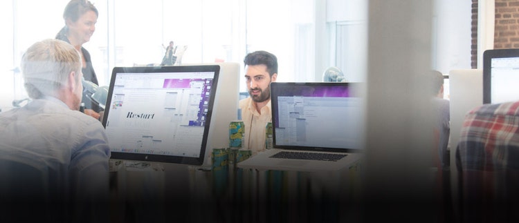 Image focused on worker in an office.