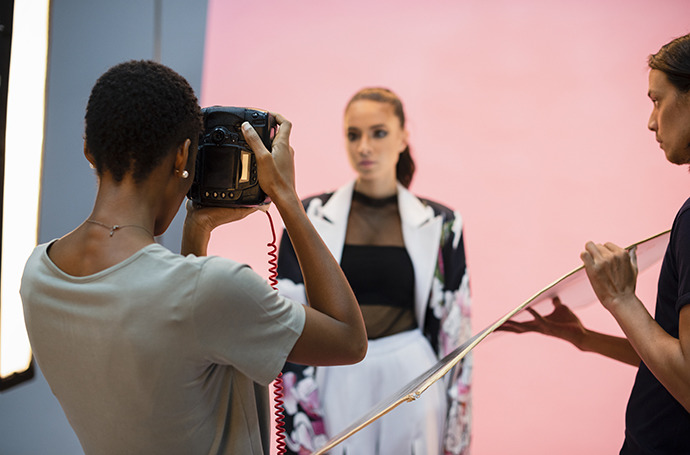 Photographer shooting a portrait of a fashion model