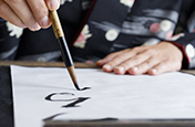 Person practising the art of calligraphy