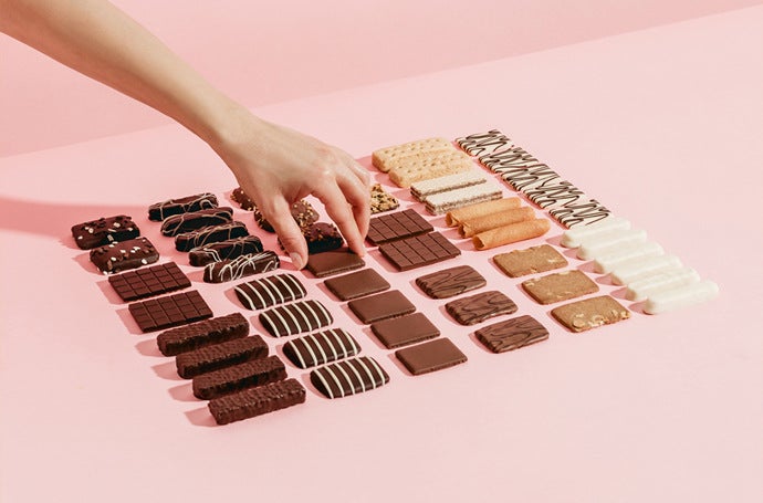 Assortment of chocolates neatly organized into a square