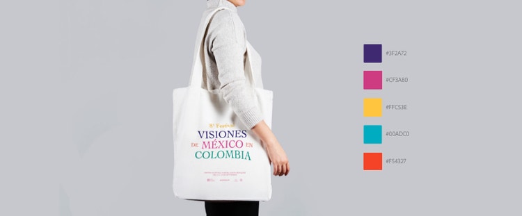 Side view of person wearing a branded tote over shoulder and color pallete floating to right