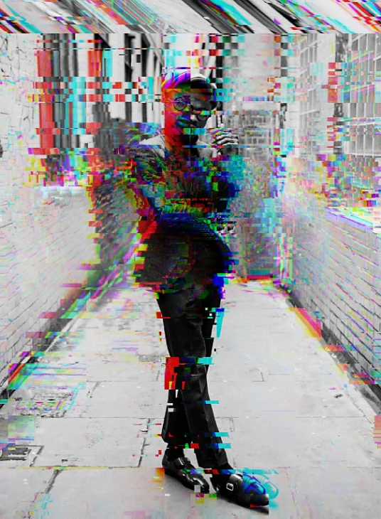 A photo of a person with a glitch effect.
