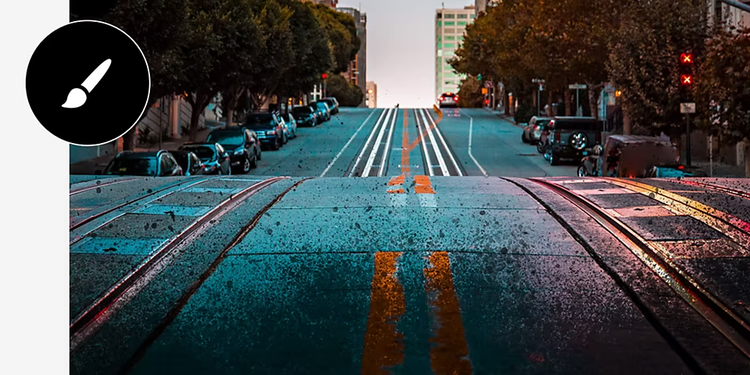 A hilly street looks dark and gritty from the application of grunge brushes with tool icon overlaid