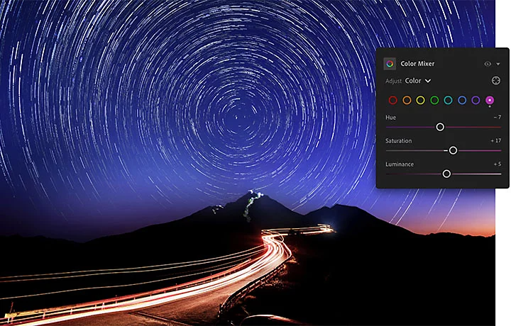 The Adobe Lightroom color mixer pane superimposed over an image of a lighted path leading to a mountaintop with star trails behind it