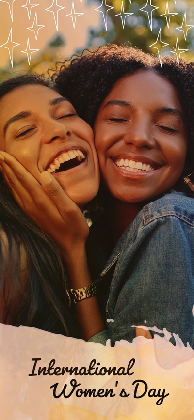 A couple of women laughing Description automatically generated