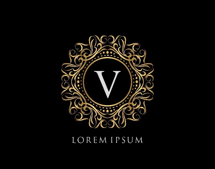 Logo vom weißen Buchstaben „V“ mit goldener, kunstvoller Umrandung. 