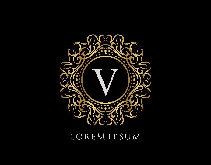 Logo vom weißen Buchstaben „V“ mit goldener, kunstvoller Umrandung.