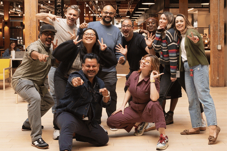 A group of people posing for a photo AI-generated content may be incorrect.