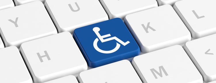 Foto de un teclado de ordenador, una tecla con el simbolo de accesibilidad