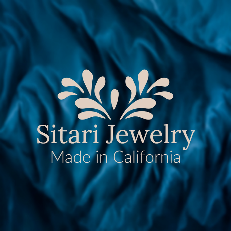 A logo for a high-end jewelry company written in two luxury fonts