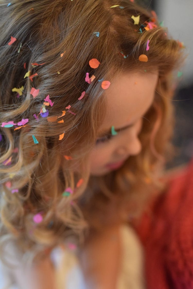Girl with confetti on her hair