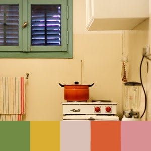 A color palette created from an image of a yellow kitchen with green windows and a red pot on a white stove