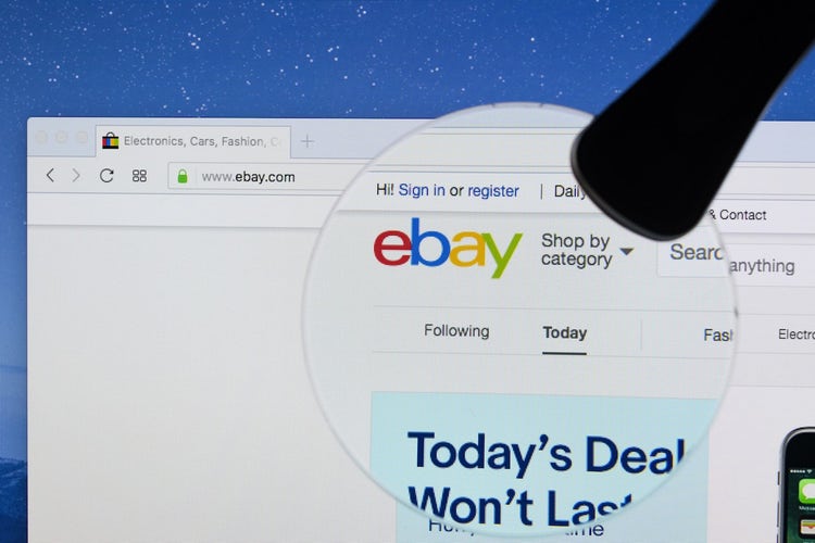 Magnifying glass over eBay logo