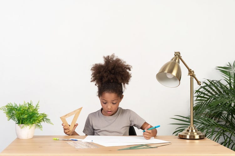 Free to use images: young girl studying in a table