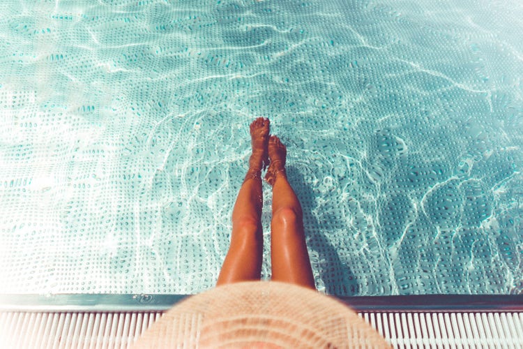 A girl's legs on the pool