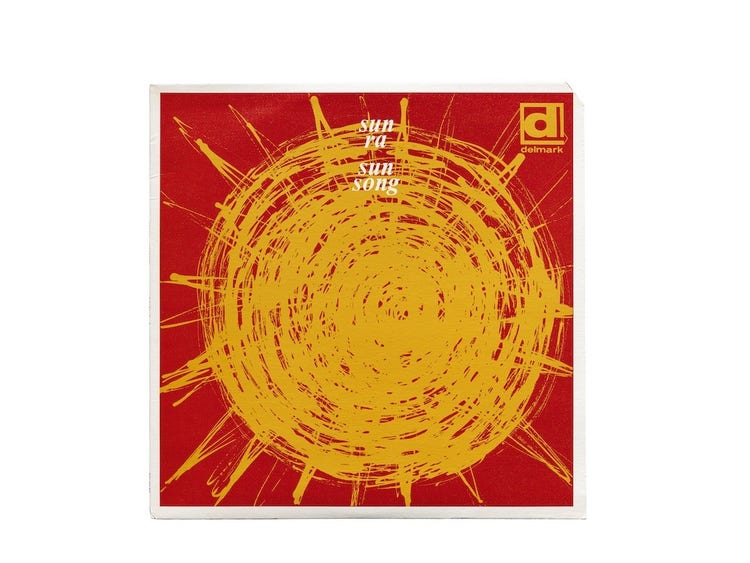 An album cover with a large sketchy yellow orange sun at center covering the majority of a red background.