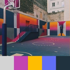 A color palette created from an image of a basketball court painted pink, yellow, and blue