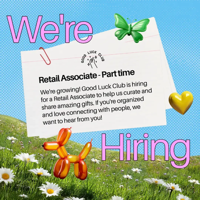A "we're hiring" job posting with playful props of a balloon dog, butterfly, and flowers