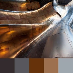 A color palette created from an image of a gold and silver industrial sculpture with the sun reflecting off of it