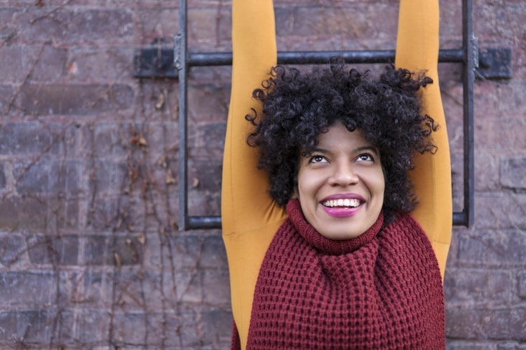 Woman with curly hair smiling