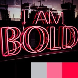 A color palette created from an image of a neon pink and red sign against a dark background