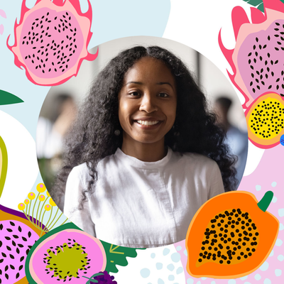 Instagram profile picture of a person with dark skin and long curly hair smiling with graphics of various fruits around them