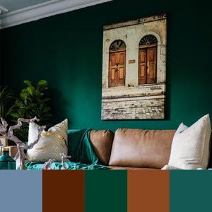 A color palette created from an image of various neutral pillows against a dark green wall with a picture of brown doors